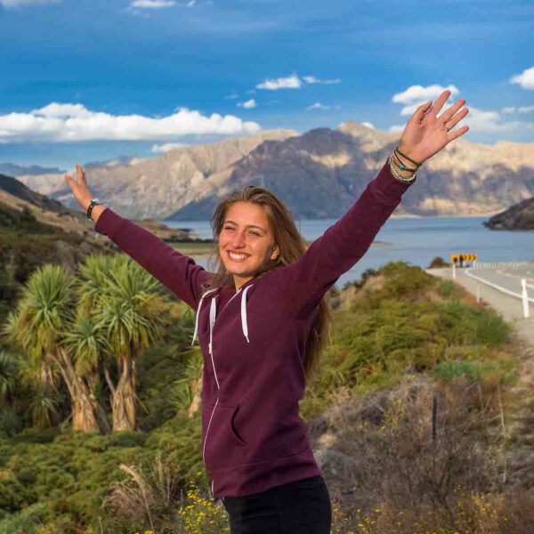 Happy Girl at The Neck - South Island tour, New Zealand. South Island Tours New Zealand.