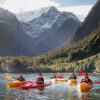 Milford Sound kayakers with Pembroke Glacier in the background screen, New Zealand