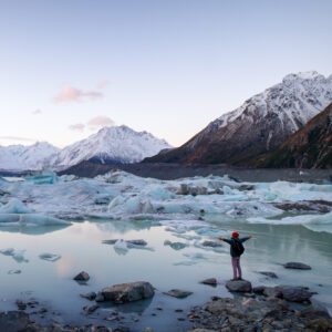 Traveler viewing icebergs landscape and snow mountains in New Zealand. tours south island new zealand, Real Kiwi Adventures Picture